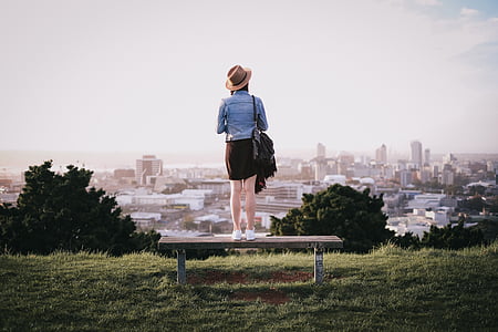 woman standing on brown bench thumbnail
