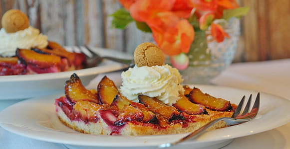 baked pie with white frosting on white ceramic plate thumbnail