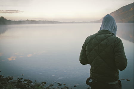 person standing near seashore during daytime thumbnail