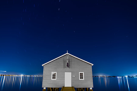 gray and white cabin during at night thumbnail
