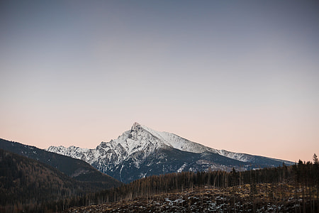 Sunset Over Snowy Top of The Mountain thumbnail