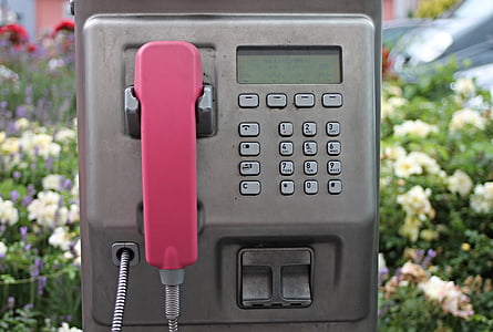 gray and pink outdoor telephone during daytime shallow focus photography thumbnail