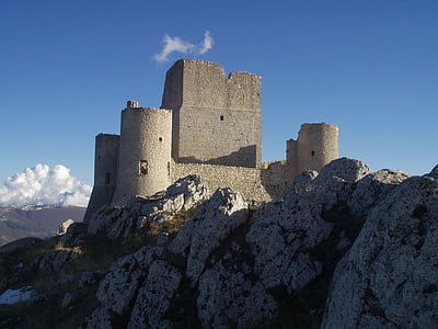 low angle photography of grey castle during daytime thumbnail