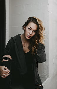 woman in black zip-up jacket posing for picture thumbnail