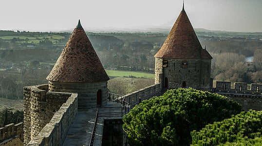 gray and brown concrete wall with watchtowers thumbnail