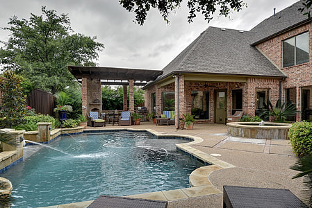 brown concrete house with swimming pools thumbnail