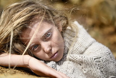 woman lying on ground photo thumbnail