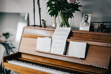 Old piano with sheet music thumbnail