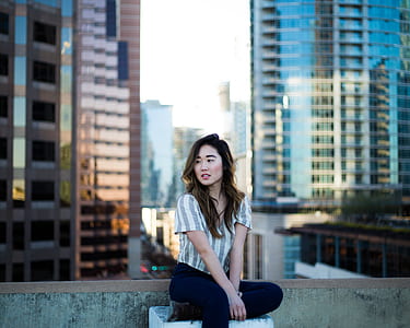 woman sitting on concrete slab thumbnail