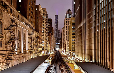 black steel train track beside high rise building thumbnail
