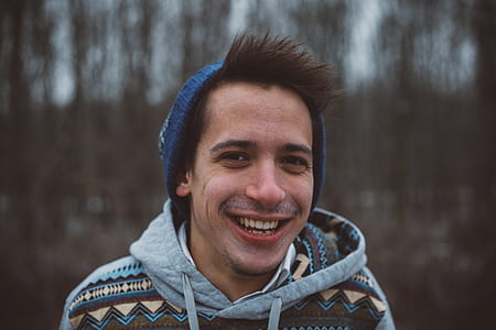 selective focus photography of man with knit hat thumbnail