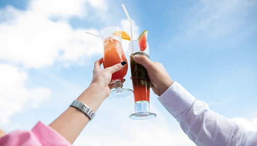 person holding cocktail drinks thumbnail