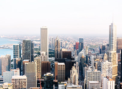 aerial photo of high rise buildings near body of water thumbnail
