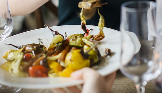 person holding vegetable platter thumbnail
