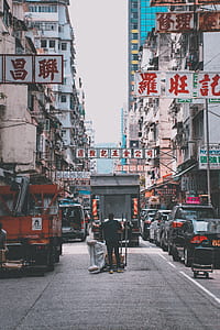 man standing between vehicles thumbnail