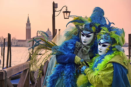 two person wearing blue-and-green mascot with masquerades thumbnail