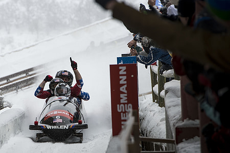 three person on snow mobile thumbnail