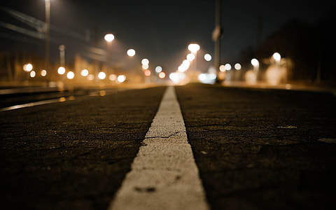 grey road with lights all over the place thumbnail