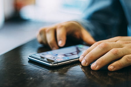 man, person, hands, iphone thumbnail