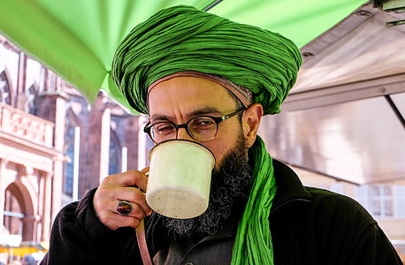 man holding white mug while drinking thumbnail