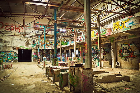 brown concrete structure filled with graffiti thumbnail