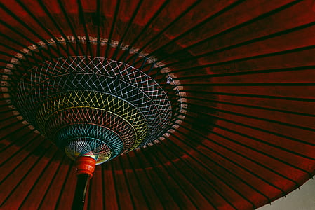low light photography of red kyoto umbrella thumbnail
