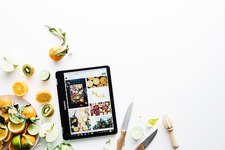 black iPad near brown and gray knife thumbnail