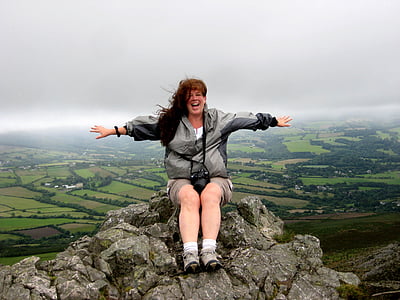 woman sitting mountain peak thumbnail