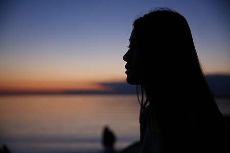 silhouette of woman holding ice cream photography thumbnail