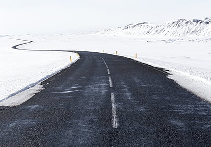 winding road near snow field thumbnail
