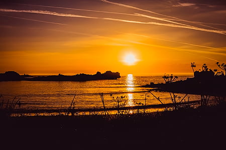 silhouette of island at sunset thumbnail