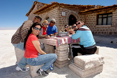 group of people sitting on chair in front of table thumbnail