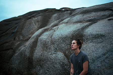 man standing near mountain thumbnail