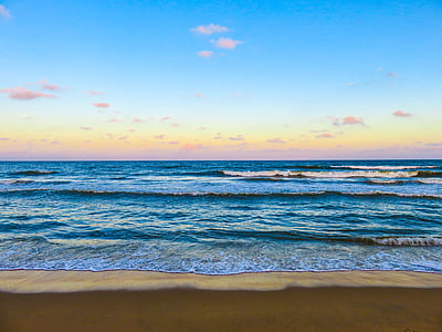 seashore under blue calm sky during golden hour thumbnail