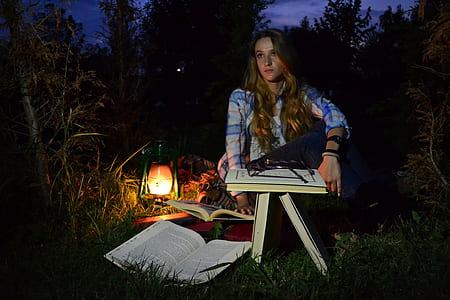 woman sitting on near grass during daytime thumbnail