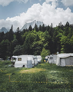 photo of camping trailer on green grass thumbnail