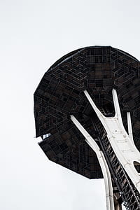 person looking at brown and white tower thumbnail