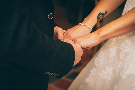 groom holding bride's hands thumbnail