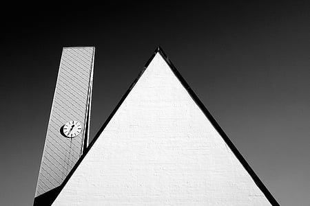 white pyramid building beside tower thumbnail