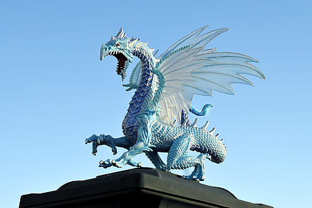 blue dragon statue under blue sky thumbnail
