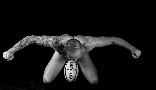 photography of man topless with Gilbert football thumbnail