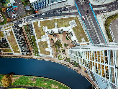 aerial photography of building beside body of water thumbnail