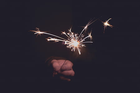 left person's hand holding sparks thumbnail
