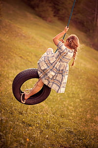 girl riding black rubber tire thumbnail
