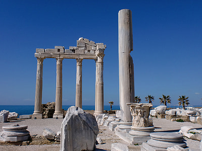 gray concrete ruins with view of body of water at daytime photo thumbnail