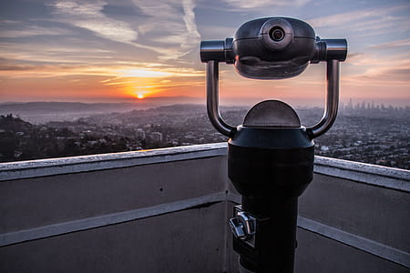 Coin-operated Tower Viewer on Rooftop during Sunset thumbnail