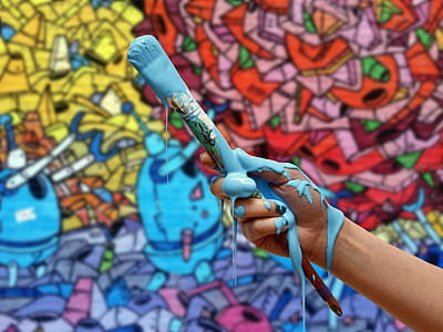 person holding paint brush thumbnail