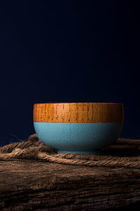 blue and brown bowl on brown plank thumbnail