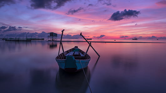 white jon boat on still waters thumbnail