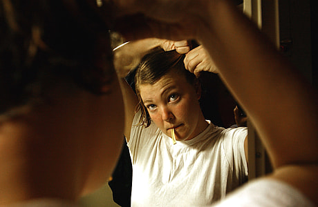 woman standing in front of mirror thumbnail